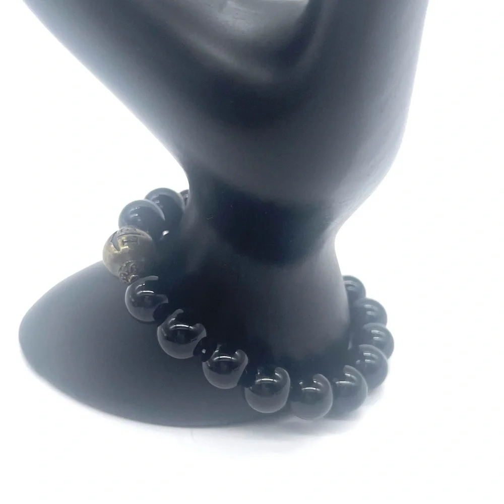 Onyx Stretch Bracelet w/ gold tone zen charm